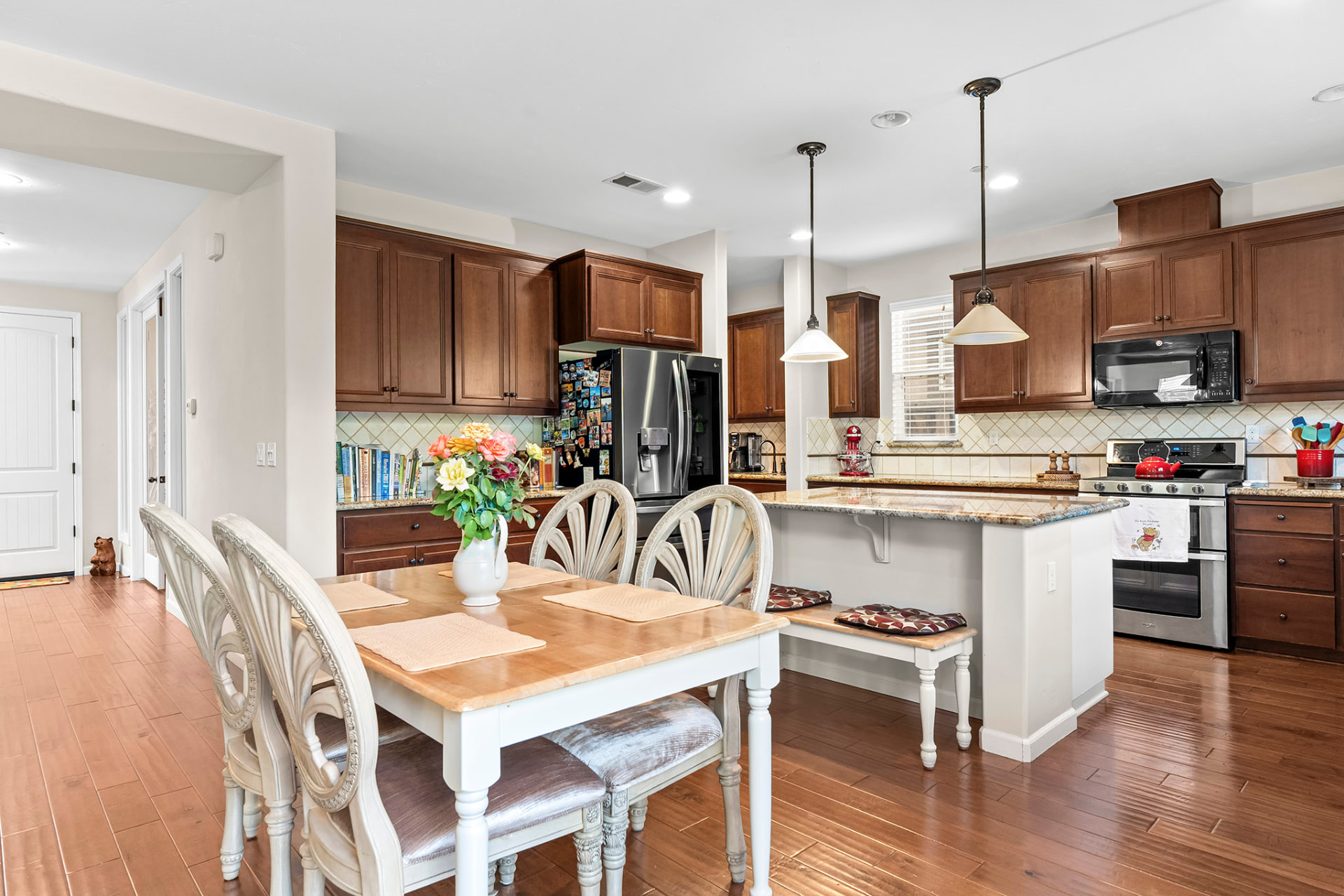 Casual dining area opening to the kitchen and breakfast bar