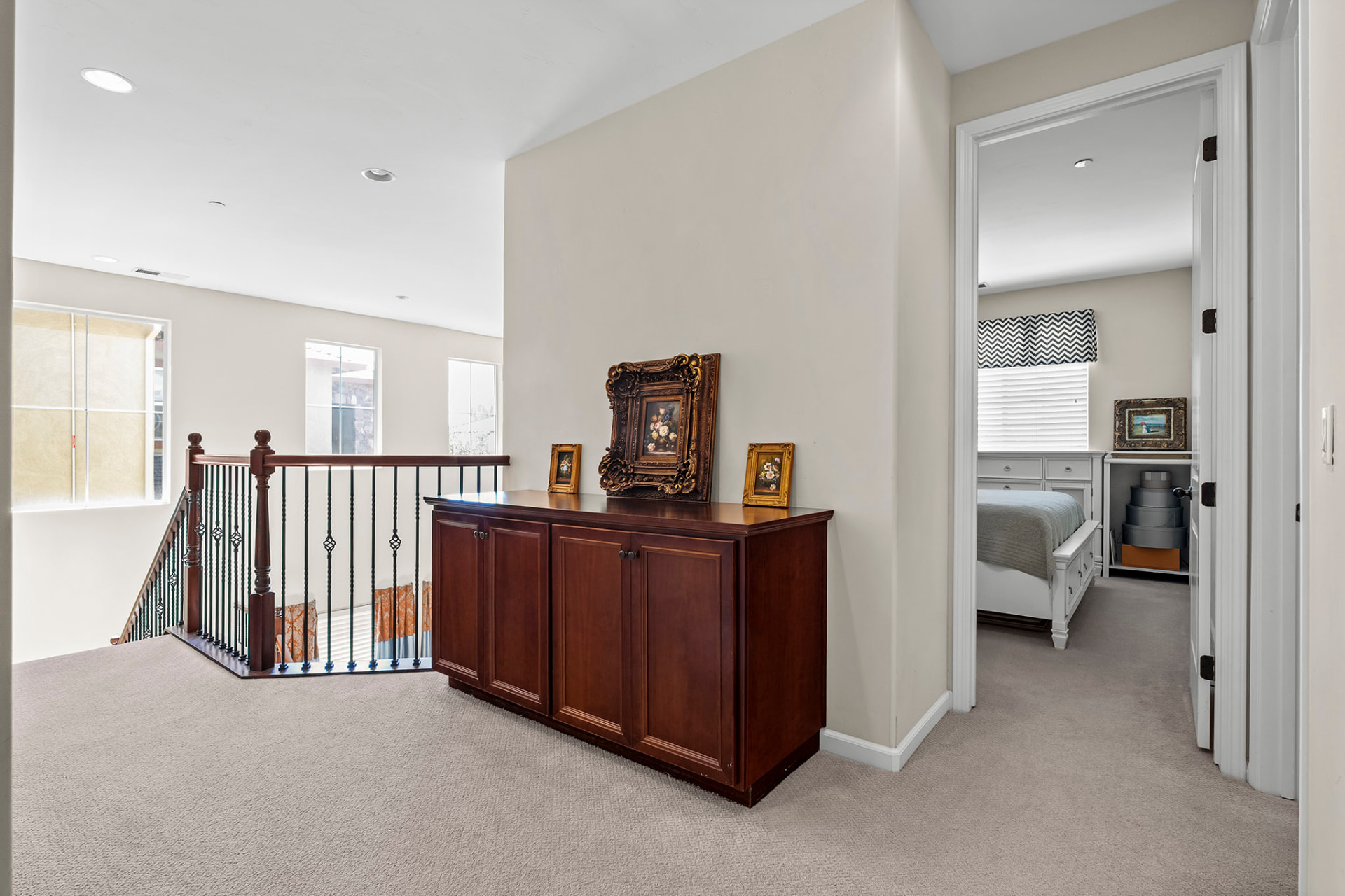 Upstairs landing overlooking the staircase with bedroom doors off the hall